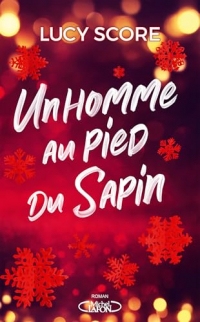 Un homme au pied du sapin